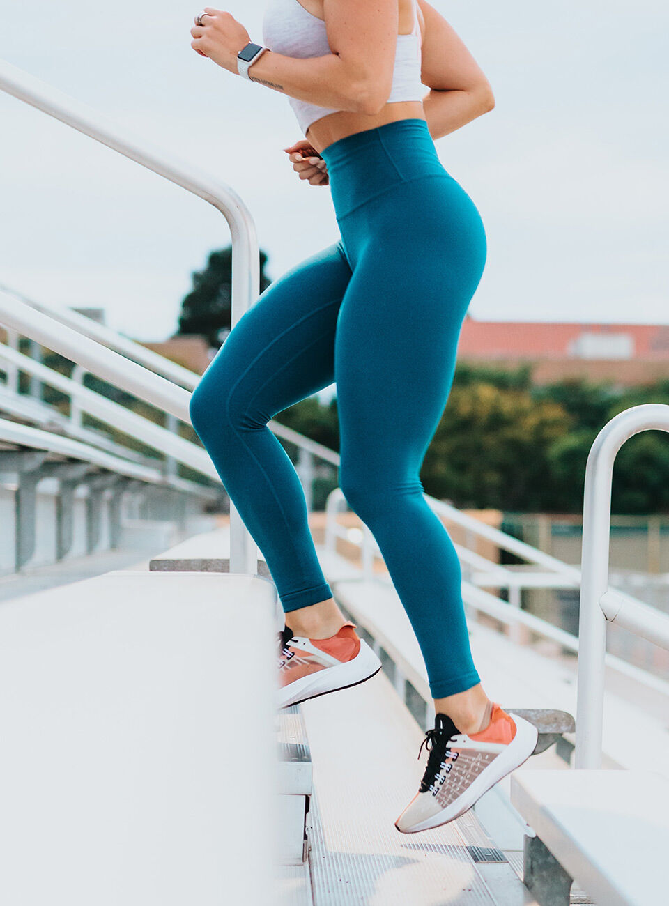 woman jogging over stairs