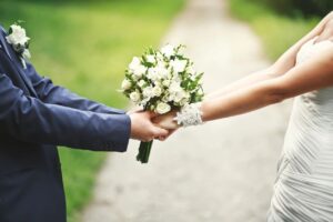 Couple holding the wedding bouquet